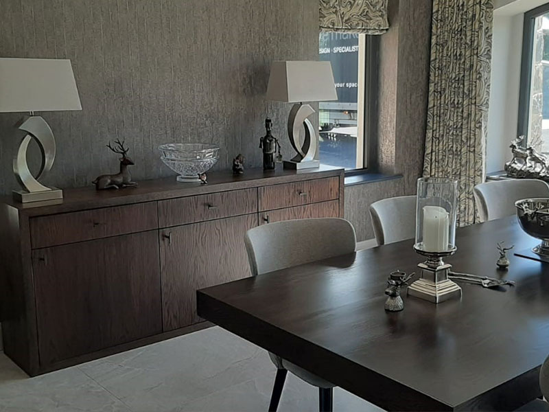 A jpeg image of a bespoke dining table and matching sideboard